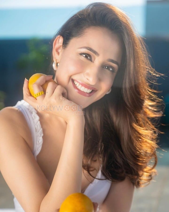 Cute Pragya Jaiswal eating Mangoes in a White Crop Top Photos 01