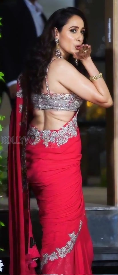 Dazzling Pragya Jaiswal in a Red Printed Saree with a Shoulder Strap Embroidered Blouse Photos 01