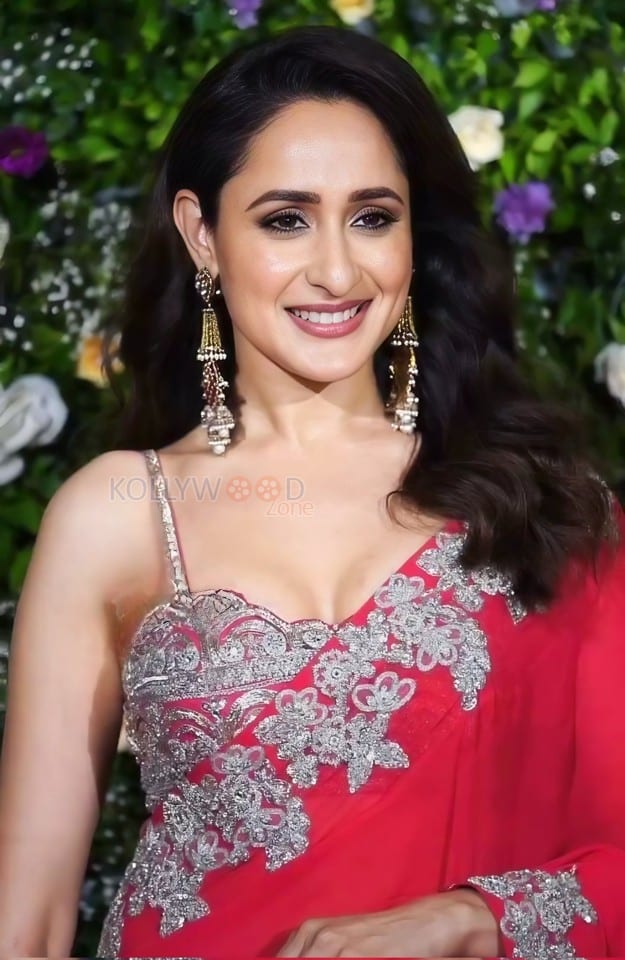 Dazzling Pragya Jaiswal in a Red Printed Saree with a Shoulder Strap Embroidered Blouse Photos 09