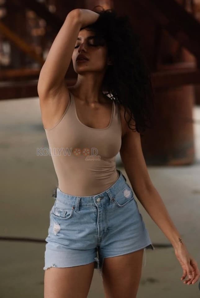 Enchanting Sobhita Dhulipala in a Beige Tank Top and Blue Denim Shorts Photos 02