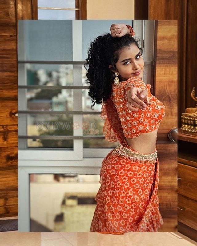 Glamorous Heroine Anupama Parameswaran in an Orange Pre Draped Saree Photos 03