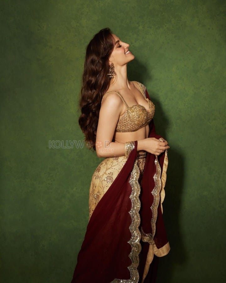 Gorgeous Elli AvrRam in a Gold Blouse with a Matching Gold Midi Skirt and a Maroon Dupatta Photos 06