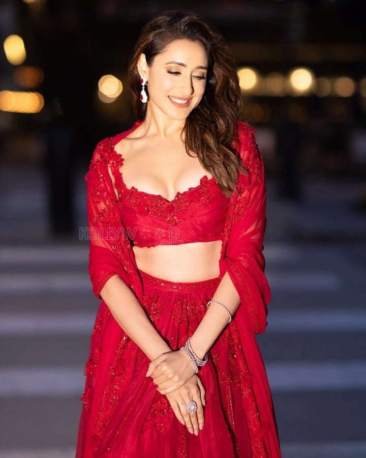 Graceful Pragya Jaiswal in a Ravishing Red Net Embroidered Organza Drape Blouse With Organza Embroidered Lehenga and Net Embroidered Dupatta Dress Pictures 04