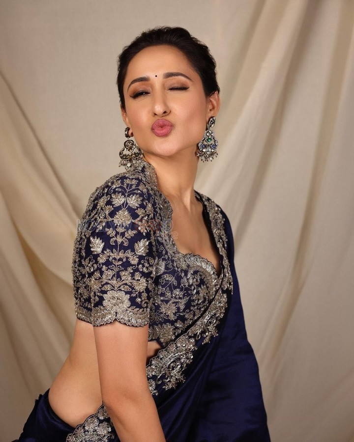 Pretty Actress Pragya Jaiswal in an Embroidered Navy Blue Saree Photos 06