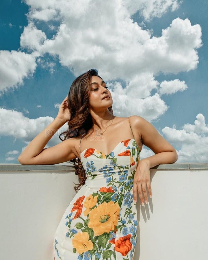 Sexy Aishwarya Arjun in a Spaghetti Strap Floral Print Dress Photos 01