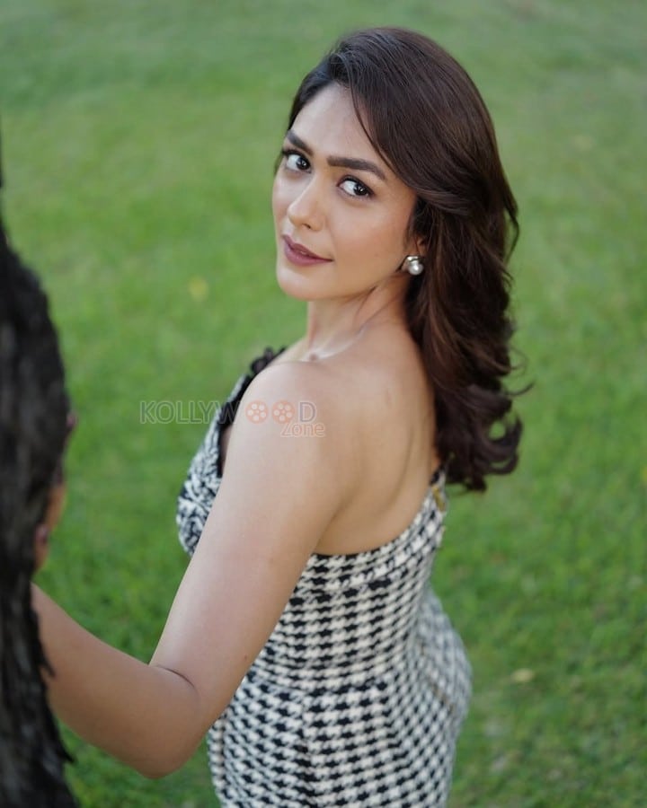 Sophisticated Mrunal Thakur in a Black and White Sleeveless Dress Photos 01