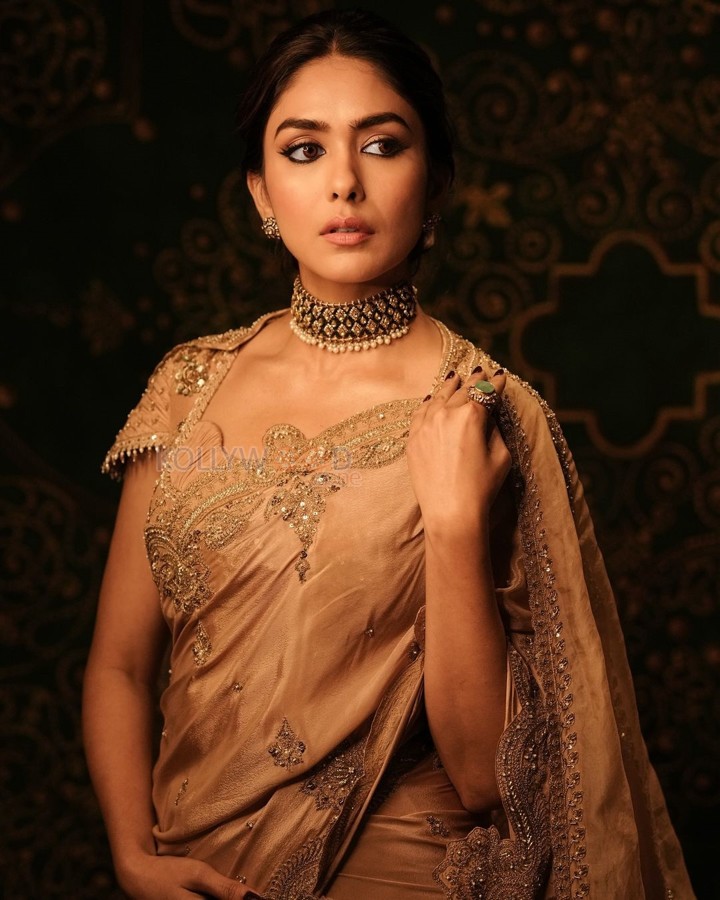 Talented Mrunal Thakur in a Golden Beige Silk Saree Photos 01