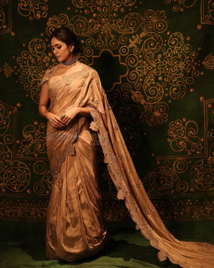 Talented Mrunal Thakur in a Golden Beige Silk Saree Photos 05