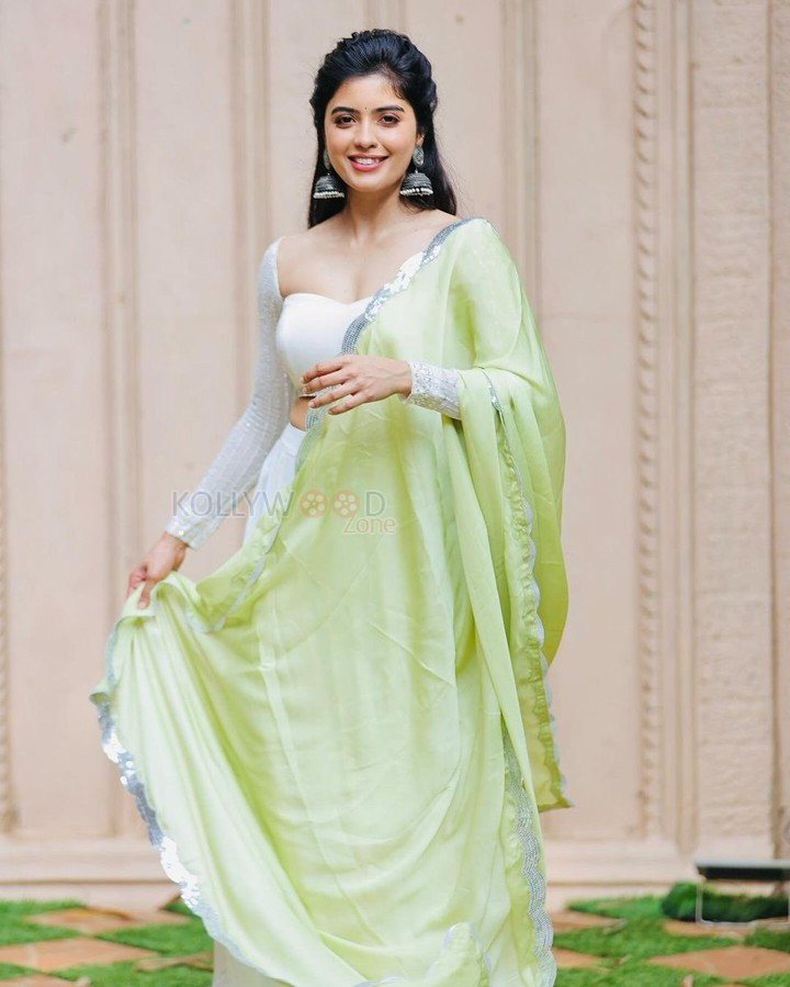 Beautiful Actress Amritha Aiyer in a Chic Green Dress Photos 03