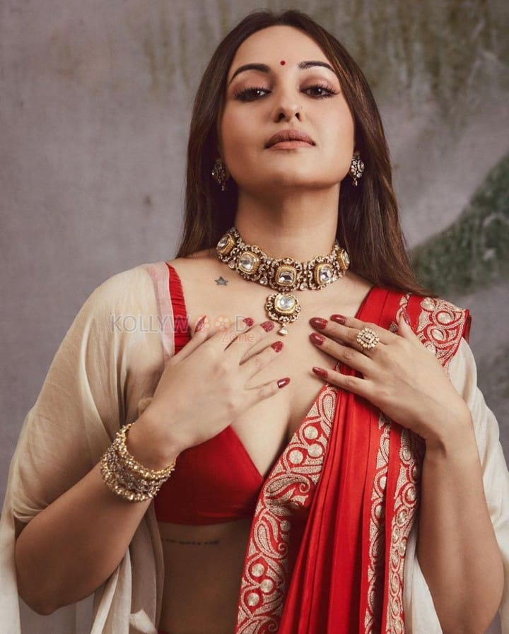 Mesmerising Sonakshi Sinha in a Red Saree with a Bralette Blouse and Beige Shrug Photos 01