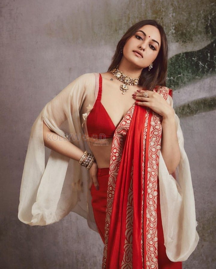 Mesmerising Sonakshi Sinha in a Red Saree with a Bralette Blouse and Beige Shrug Photos 04