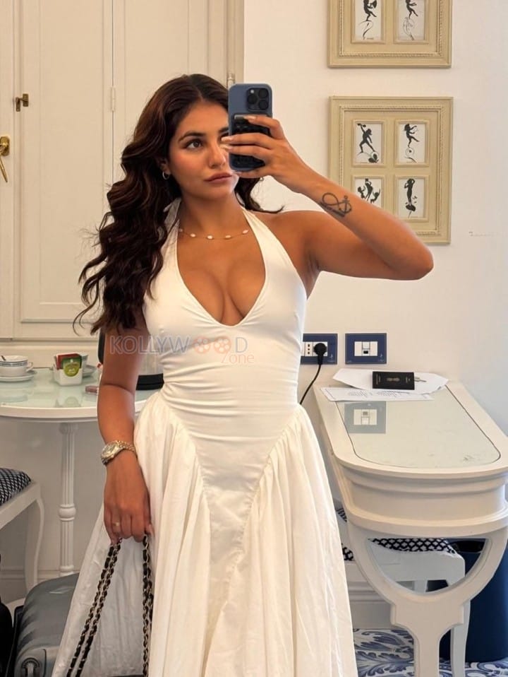 Stunning Radhika Seth Cleavage in a White Halter A Line Midi Dress Photos 01