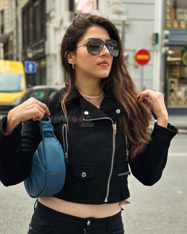 Stylish Mehreen Pirzada in a Black Biker Jacket with a Matching Black Pant and Blue Handbag Photos 02