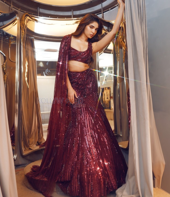 Dazzling Krithi Shetty in a Maroon Designer Lehenga Choli Photos 01