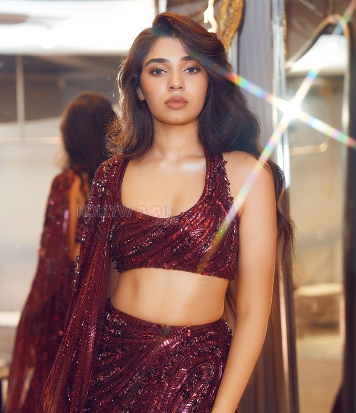 Dazzling Krithi Shetty in a Maroon Designer Lehenga Choli Photos 02