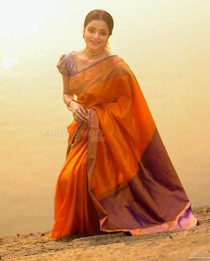 Gorgeous Janani Iyer in an Orange Silk Saree Photos 01