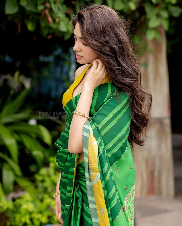 Love Insurance Kompany Actress Krithi Shetty in a Green Saree with a Yellow Halter Neck Blouse Pictures 02