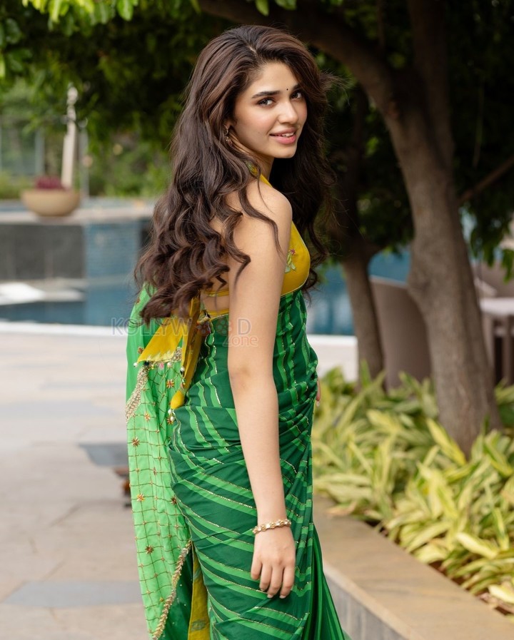 Love Insurance Kompany Actress Krithi Shetty in a Green Saree with a Yellow Halter Neck Blouse Pictures 04