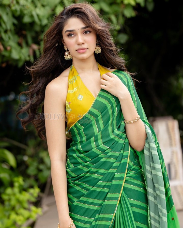 Love Insurance Kompany Actress Krithi Shetty in a Green Saree with a Yellow Halter Neck Blouse Pictures 07