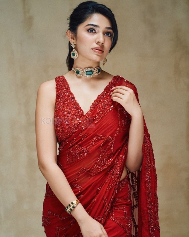 Stunning Hot Diva Krithi Shetty in a Maroon Saree with Embroidered Sleeveless Blouse Photos 02