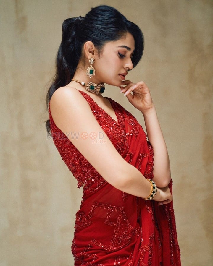 Stunning Hot Diva Krithi Shetty in a Maroon Saree with Embroidered Sleeveless Blouse Photos 07