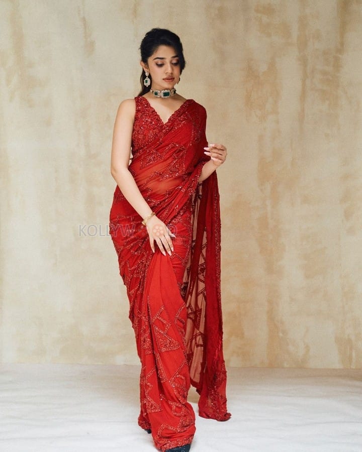 Stunning Hot Diva Krithi Shetty in a Maroon Saree with Embroidered Sleeveless Blouse Photos 08