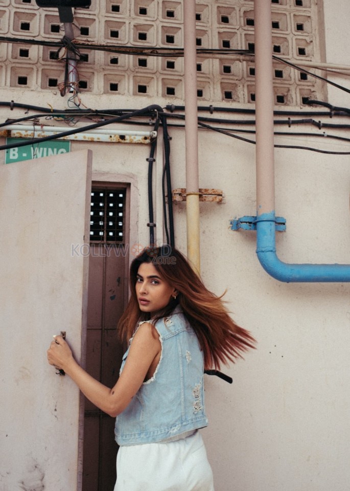 Sexy Karishma Sharma in a Sleeveless Denim Jacket with White Pant Pictures 01