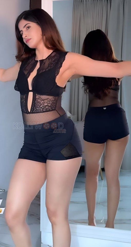 Provocative Sakshi Malik in a Black Crop Top and Mini Shorts Pictures 02