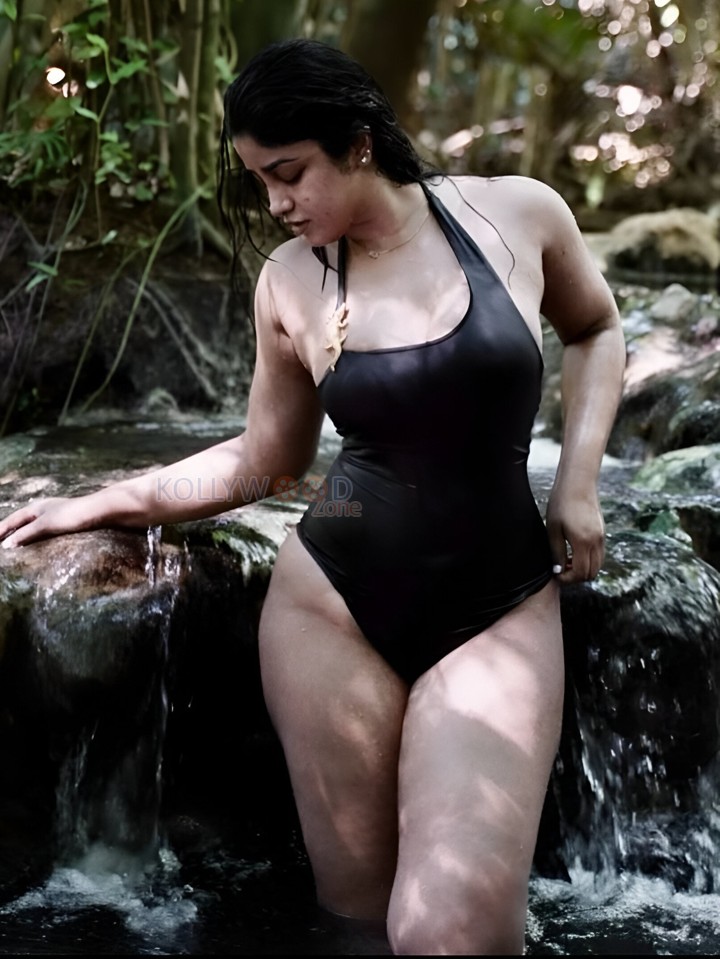 Sensuous Dimple Hayati in a Black One Piece Swimsuit Bikini Photos 01