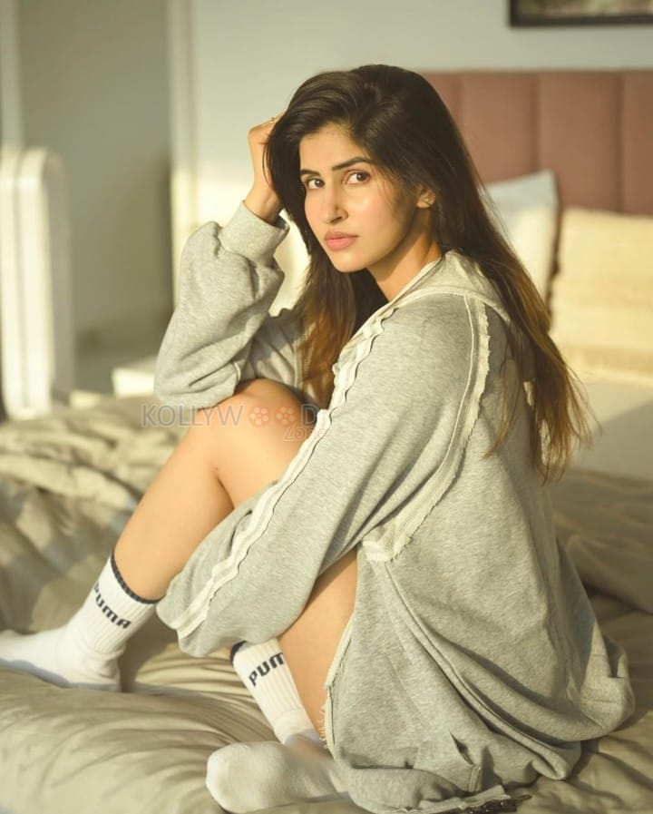 Stylish Sakshi Malik in a Mini White Top and Mini Bottom with a Grey Coat Photos 03