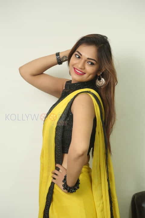 Actress Aswini Beautiful Yellow Saree Photos 48