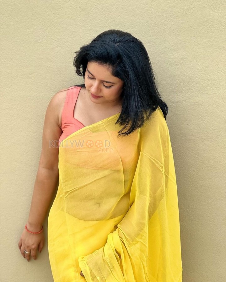 Mesmerizing Poonam Bajwa in a Yellow Saree with Sleeveless Orange Blouse Photos 05