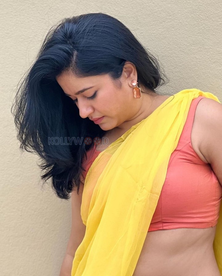 Mesmerizing Poonam Bajwa in a Yellow Saree with Sleeveless Orange Blouse Photos 06