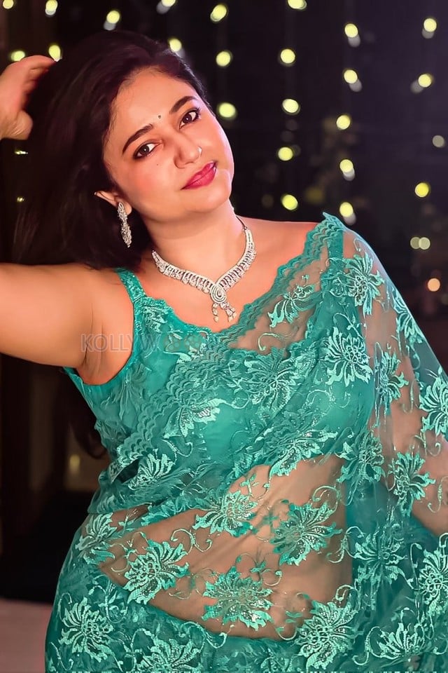 Sexy Poonam Bajwa in a See Through Turquoise Saree with Sleeveless Blouse Photos 03