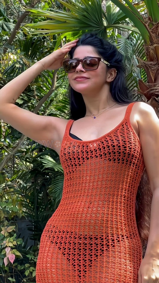 Erotic Divya Bharathi in a Black Bikini with an Orange Fishnet Mini Dress Pictures 01