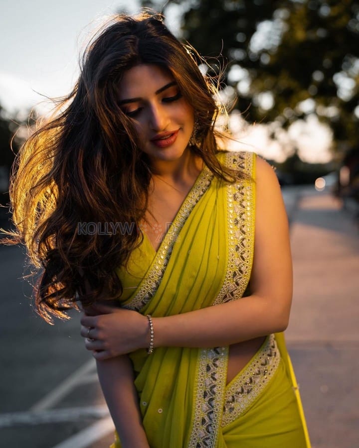 Gorgeous Sreeleela in a Yellow Georgette Saree with a Sleeveless Cutout Blouse Pictures 01