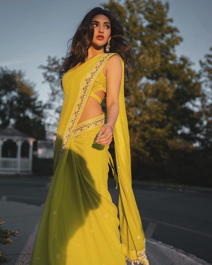 Gorgeous Sreeleela in a Yellow Georgette Saree with a Sleeveless Cutout Blouse Pictures 03