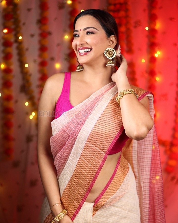 Stunning Eshanya Maheshwari in a White and Pink Saree with a Sleeveless Pink Blouse Photos 02