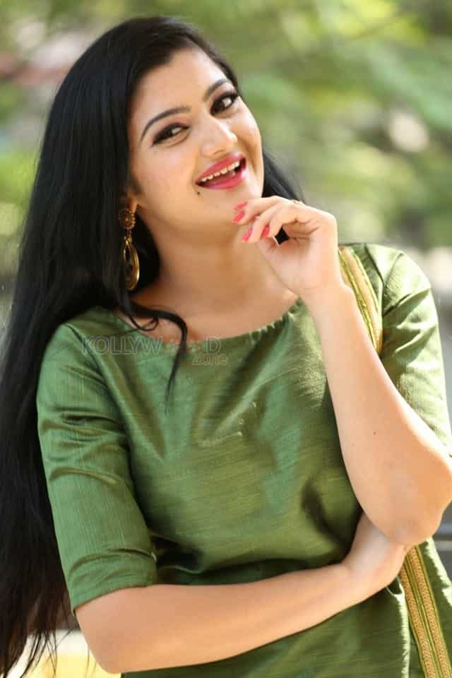 Actress Akshita Green Dress Photos 04