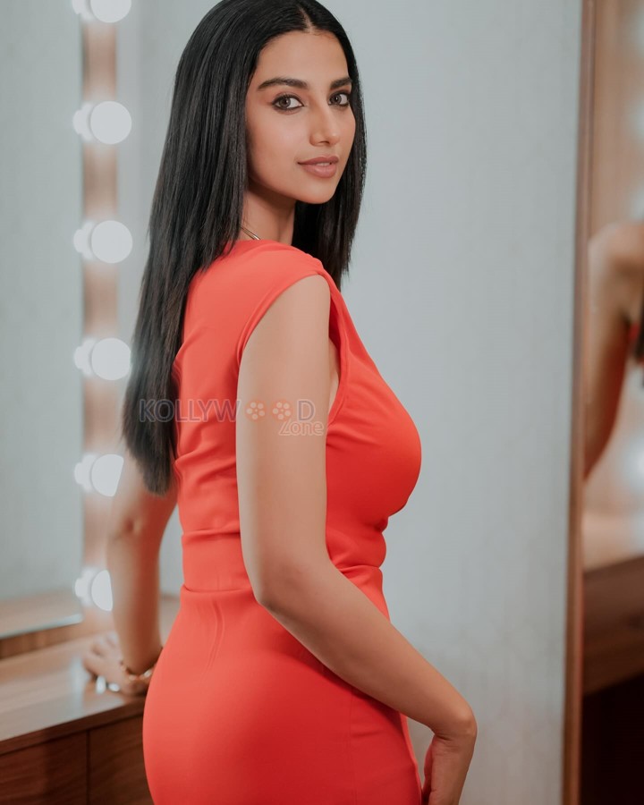 Gorgeous Heroine Meenakshi Chaudhary in a Red Bodycon Dress Photos 03