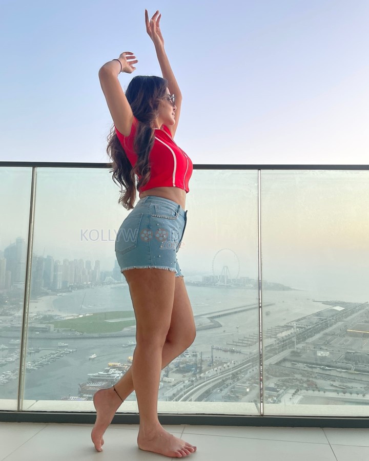 Sexy Ashu Reddy in a Red Crop Top and Mini Denim Shorts Photos 01