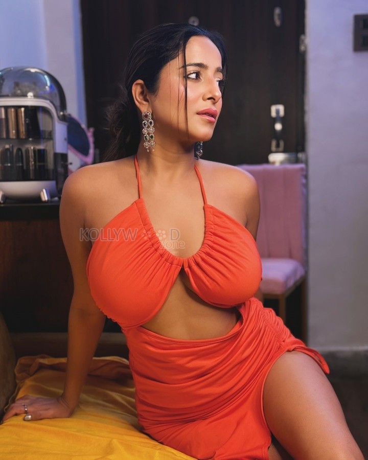 Curvaceous Kate Sharma in a Hot Orange Cut Out Topless Dress Photos 08