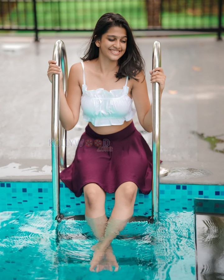 Sexy Ananthika Sanilkumar in a White Crop Top and Mini Skirt By the Pool Photos 03