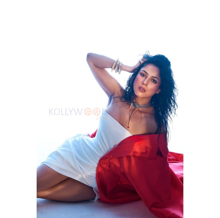 Sexy Shehnaaz Gill in a White Off Shoulder Dress with a Red Cape Pictures 04