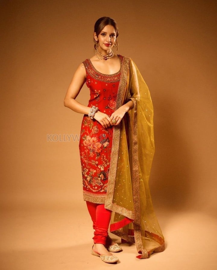 Charming Tripti Dimri in a Red Chudidar Suit Photos 01