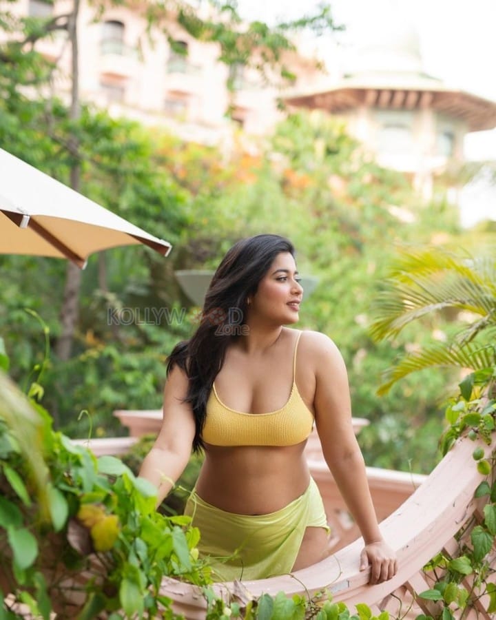 Seductive Nikita Sharma in a Yellow Bralette and Revealing Sarong Photos 02