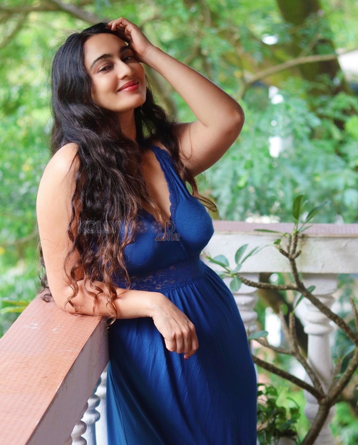 Dazzling Megha Shukla in a Blue Maxi Dress with Plunging Neckline Photos 04