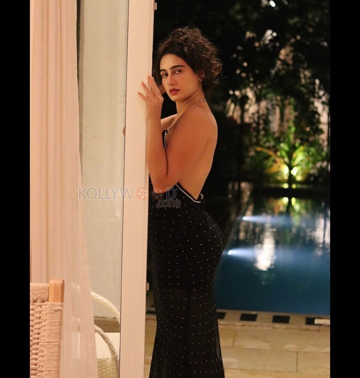 Enchanting Megha Shukla in a Printed Black Deep Neck Maxi Dress Photos 02