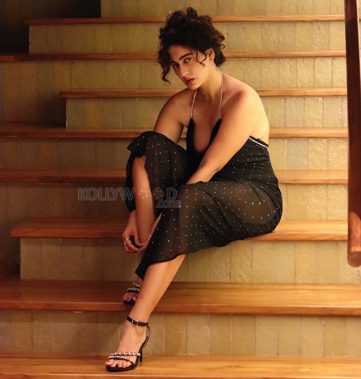 Enchanting Megha Shukla in a Printed Black Deep Neck Maxi Dress Photos 03