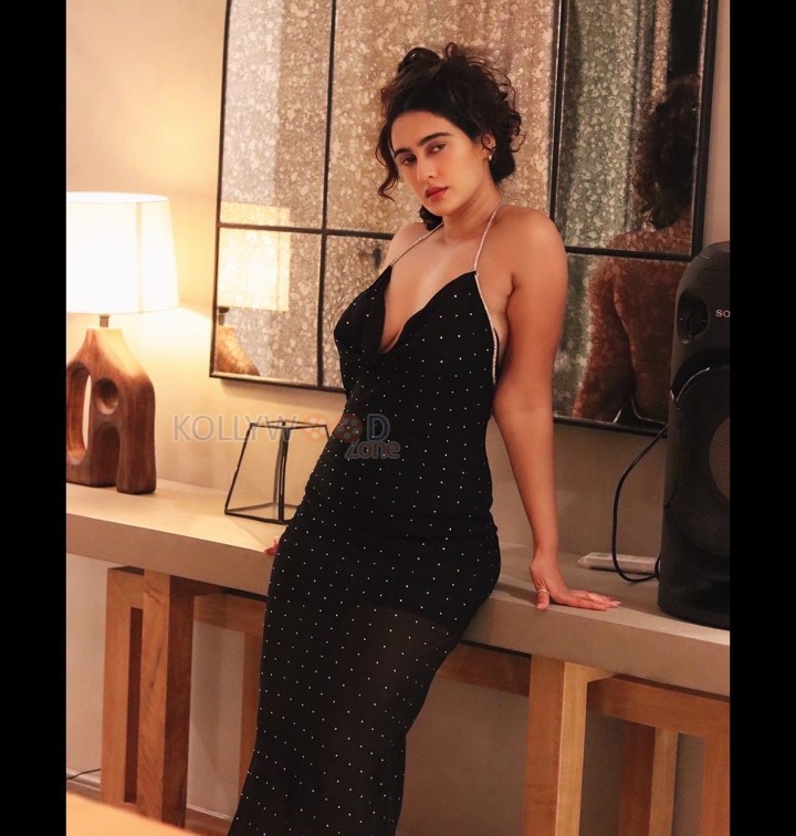 Enchanting Megha Shukla in a Printed Black Deep Neck Maxi Dress Photos 05